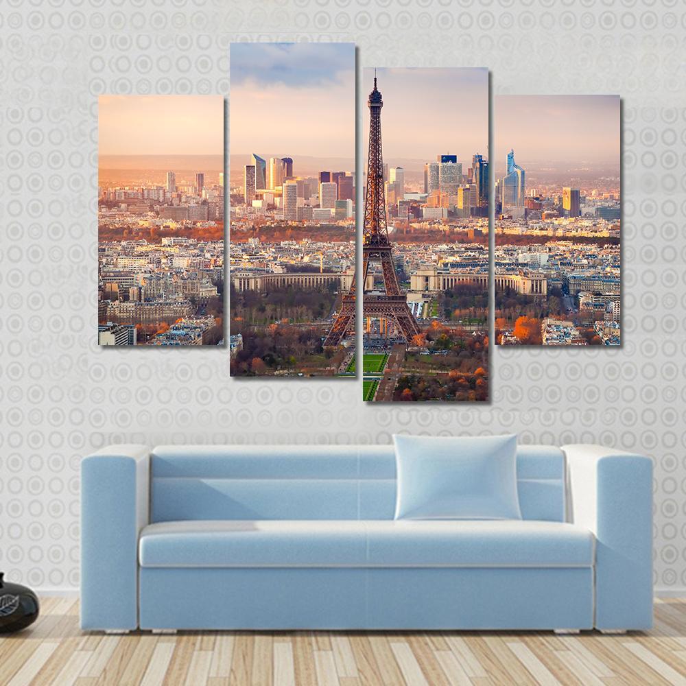 Eiffel Tower at Sunset Over Paris Canvas Wall Art in orange, yellow and blue, single panel hung on a wall