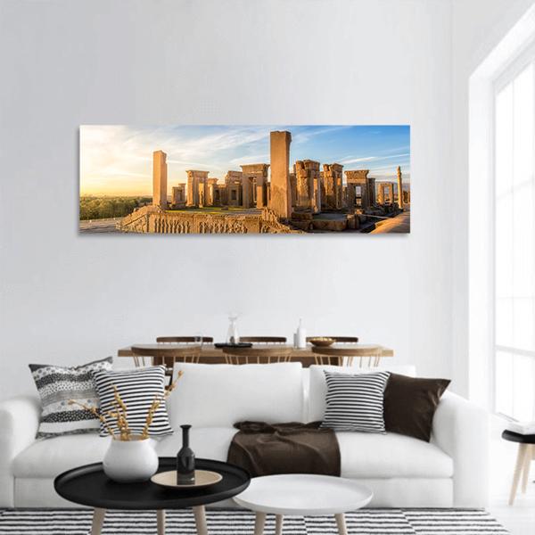 Persepolis Ruins at Golden Hour Panoramic Canvas Wall Art in beige, gold and blue, single panel hung on a wall