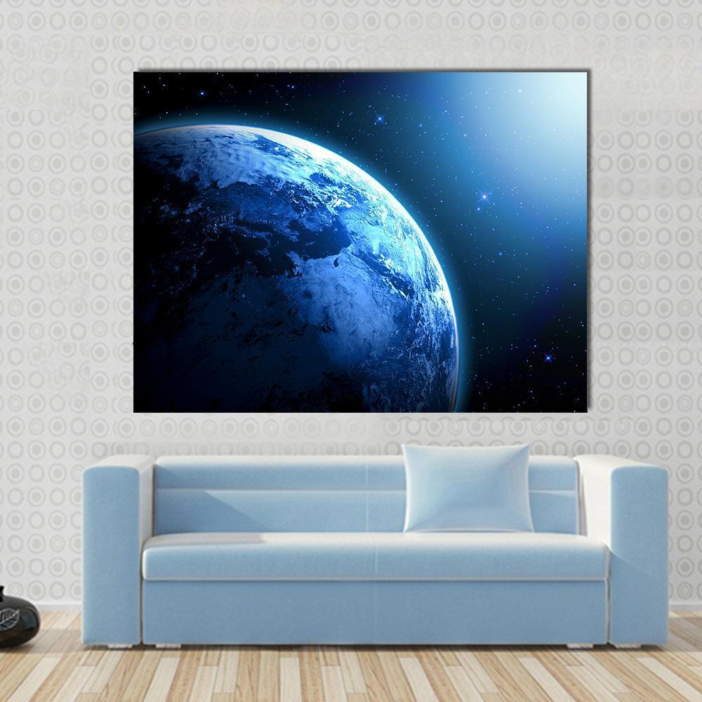 View of Planet from Space Canvas Wall Art in black and blue, single panel hung on a wall