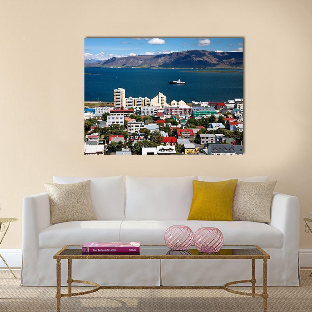 Scenic View of Reykjavik Cityscape Canvas Wall Art in white, gray and blue, single panel hung on a wall