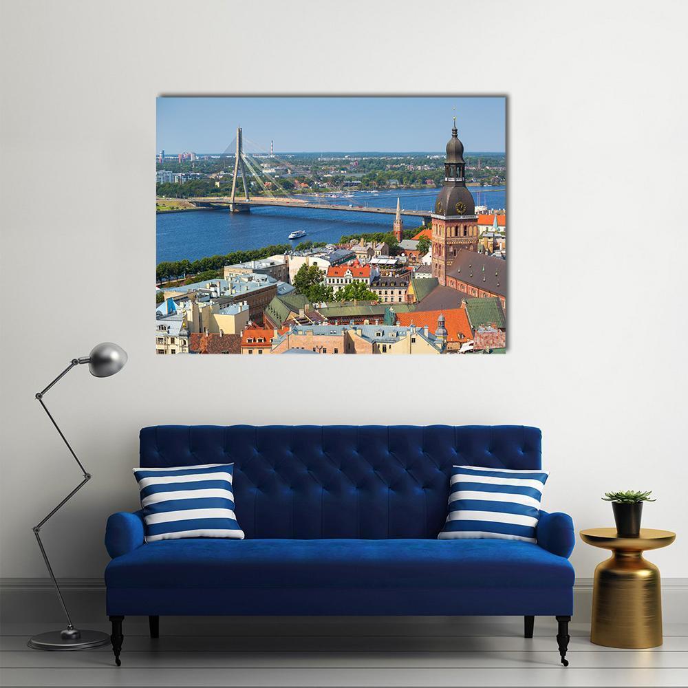Aerial View of Riga Skyline Canvas Wall Art in orange, green and blue, single panel hung on a wall