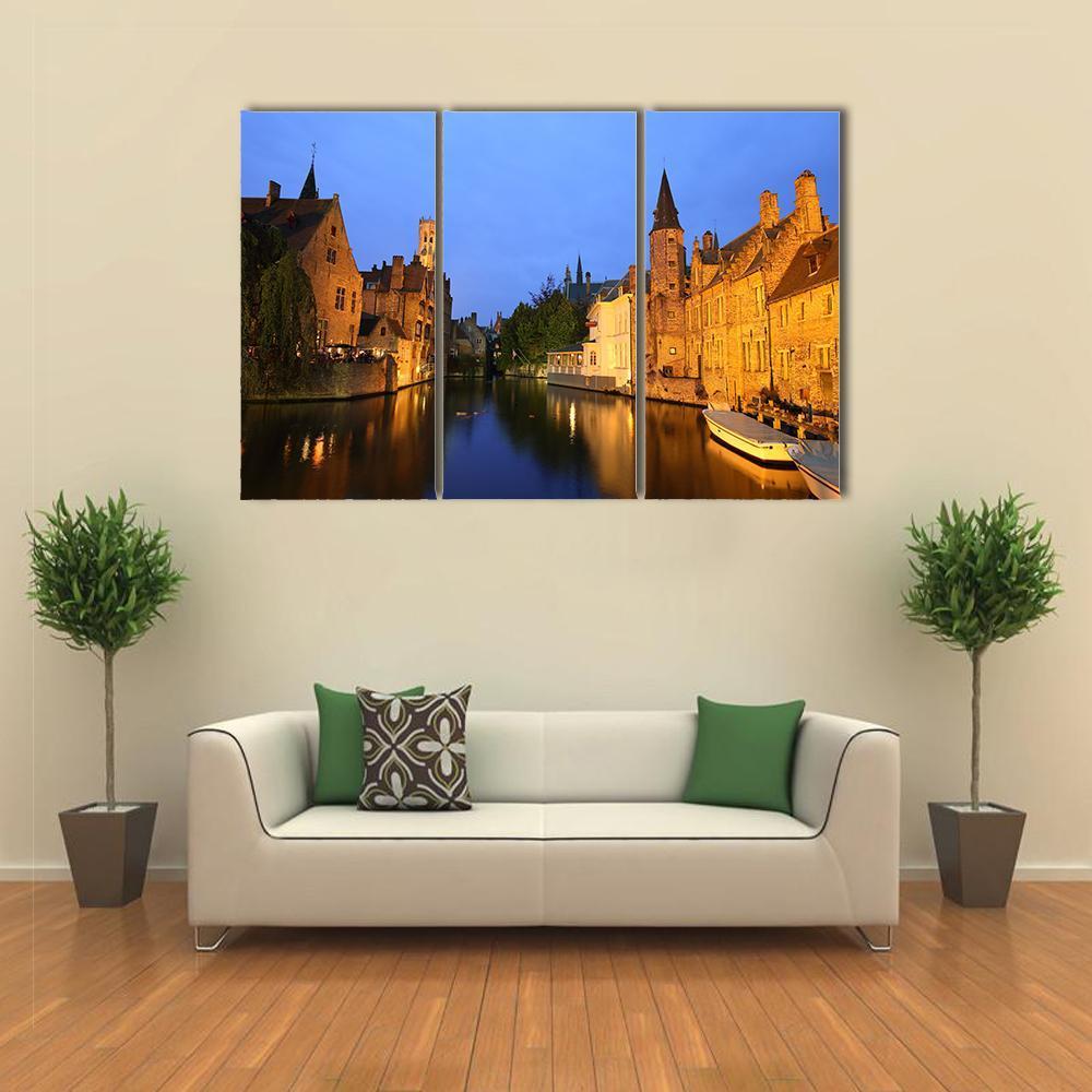 Rozenhoedkaai View in Brugge Canvas Wall Art in brown, yellow and blue, 3 panel horizontal set hung on a wall