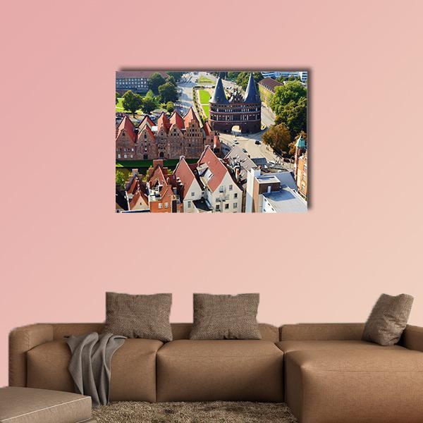 Holstentor and Salzspeicher in Lübeck Canvas Wall Art in gray, red and green, single panel hung on a wall