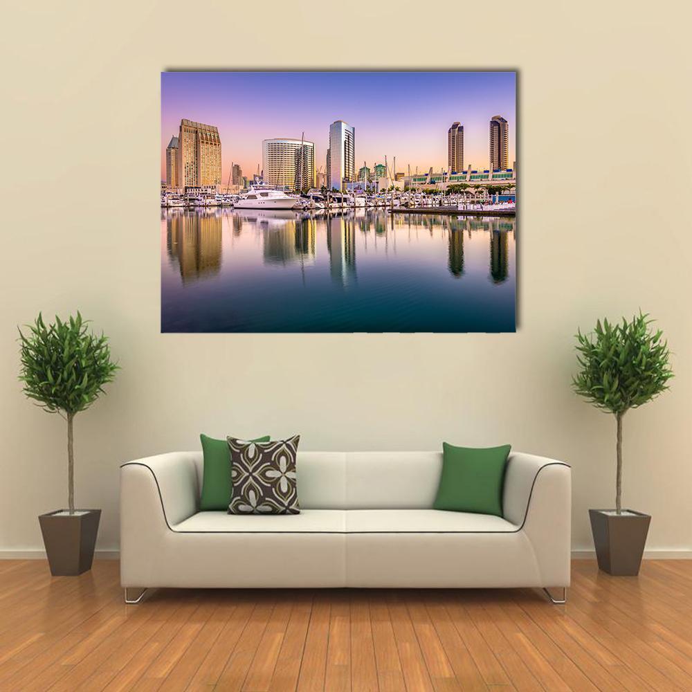Dusk Marina Cityscape with Reflections Canvas Wall Art in yellow, blue and purple, single panel hung on a wall