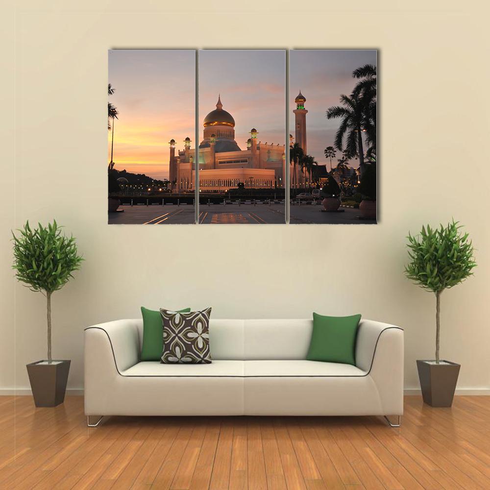 Sultan Omar Ali Saifuddin Mosque at Dusk Canvas Wall Art in gold, orange and blue, 3 panel horizontal set hung on a wall