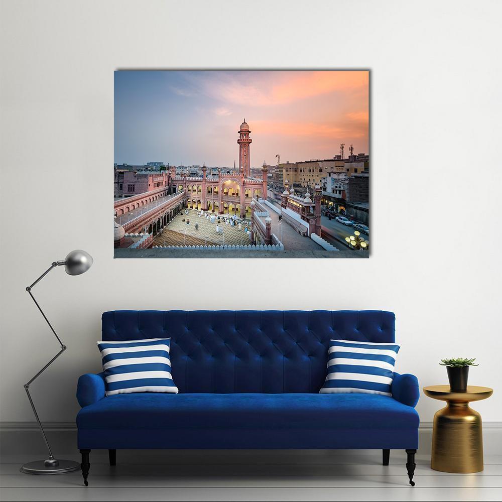 Sunehri Masjid at Sunset Canvas Wall Art in orange, blue and pink, single panel hung on a wall