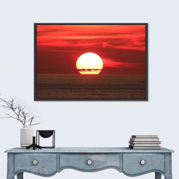 Sunset Over the Sea Canvas Wall Art in red, orange and yellow, framed canvas, product view on a white background