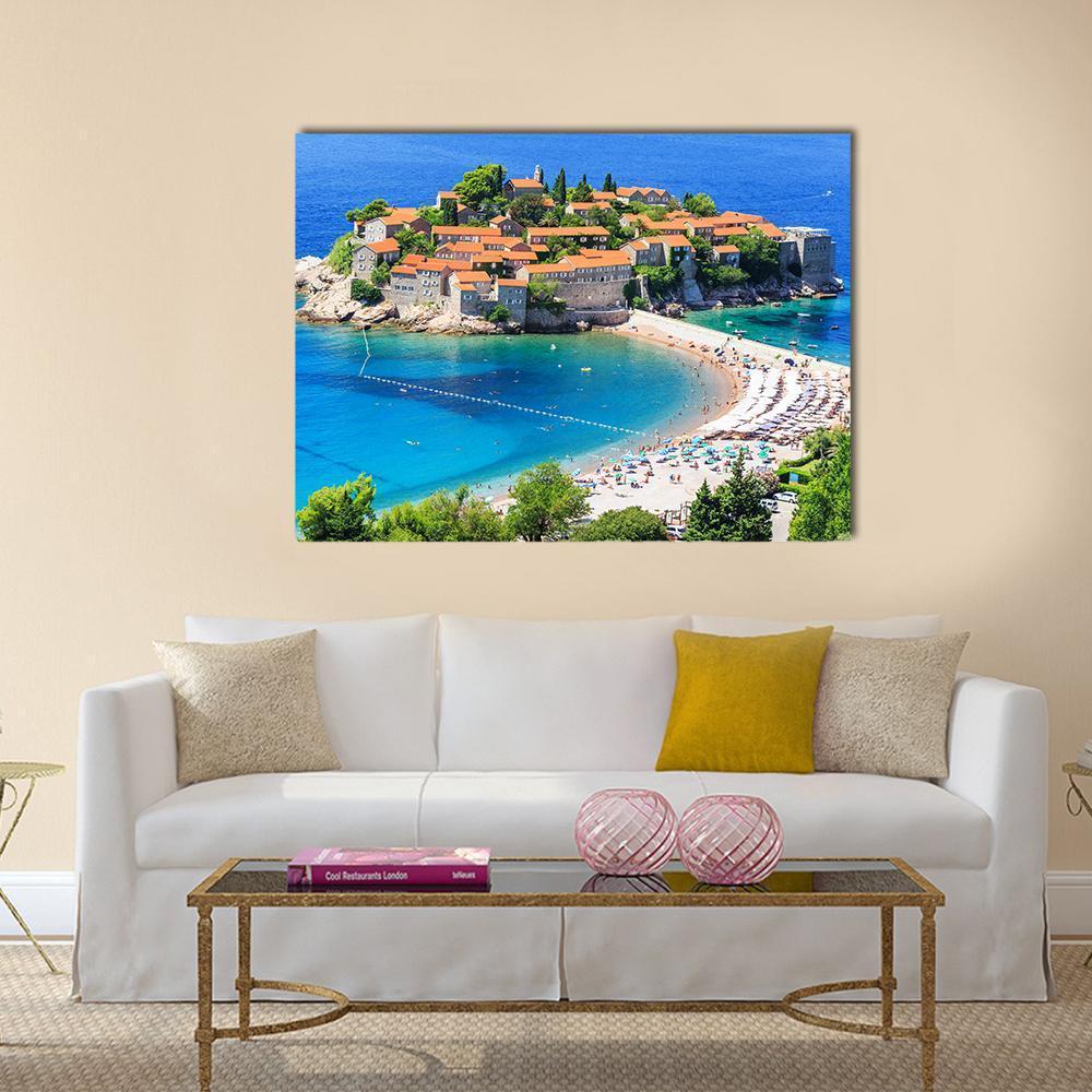 Sveti Stefan Island View Canvas Wall Art in orange, green and blue, single panel hung on a wall