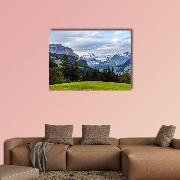 Wengen View of the Swiss Alps Canvas Wall Art in gray, green and blue, single panel hung on a wall