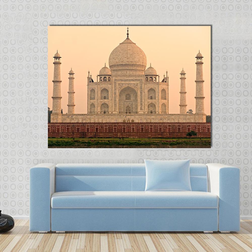 Taj Mahal at Sunrise Canvas Wall Art in beige, orange and yellow, single panel hung on a wall