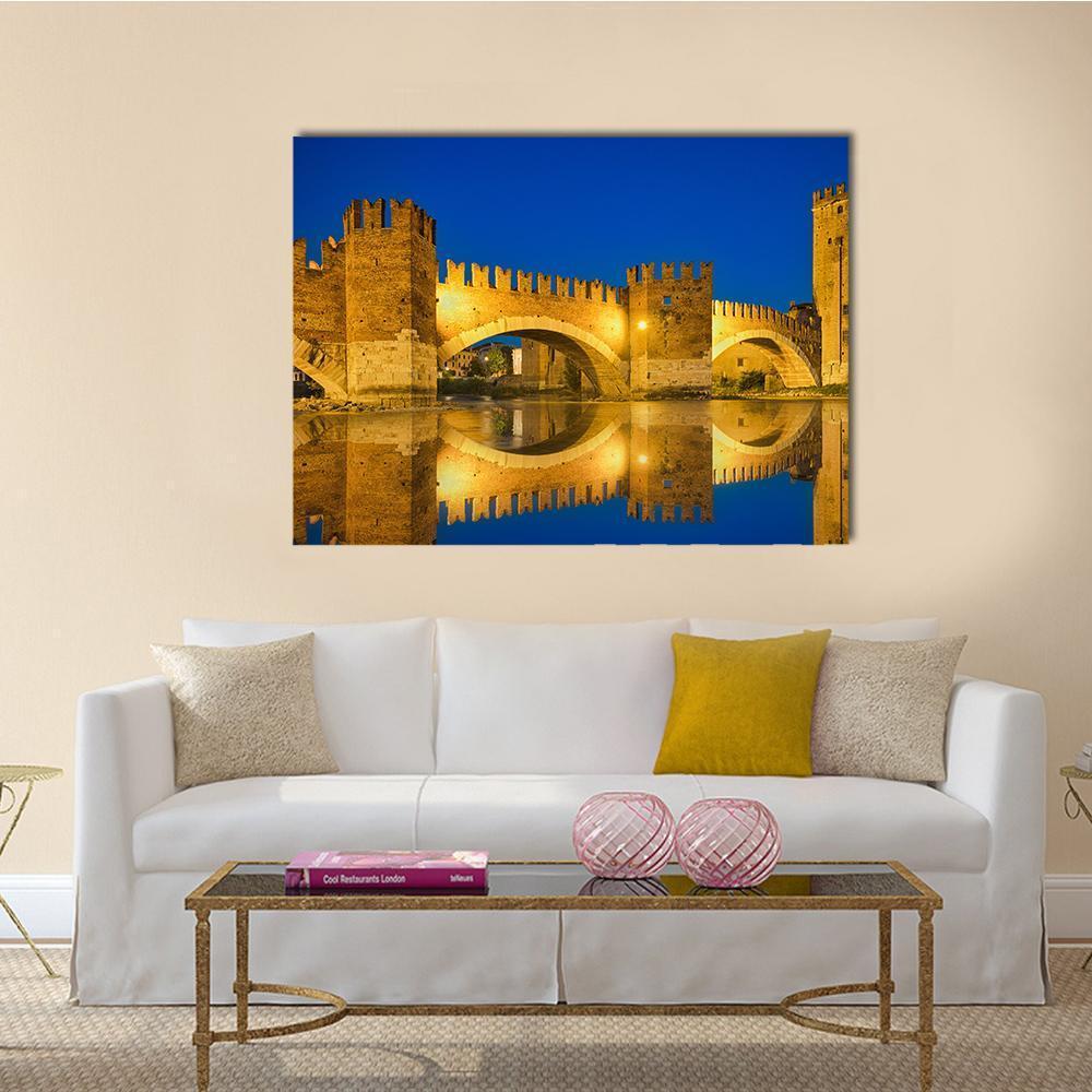 Castelvecchio Bridge at Twilight Canvas Wall Art in gold, yellow and blue, single panel hung on a wall