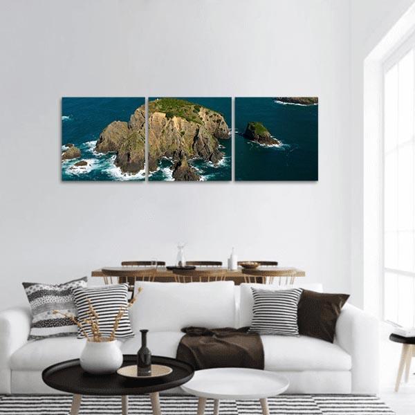 Cavalli Islands Coastal Aerial View Panoramic Canvas Wall Art in brown, green and blue, hung on a wall
