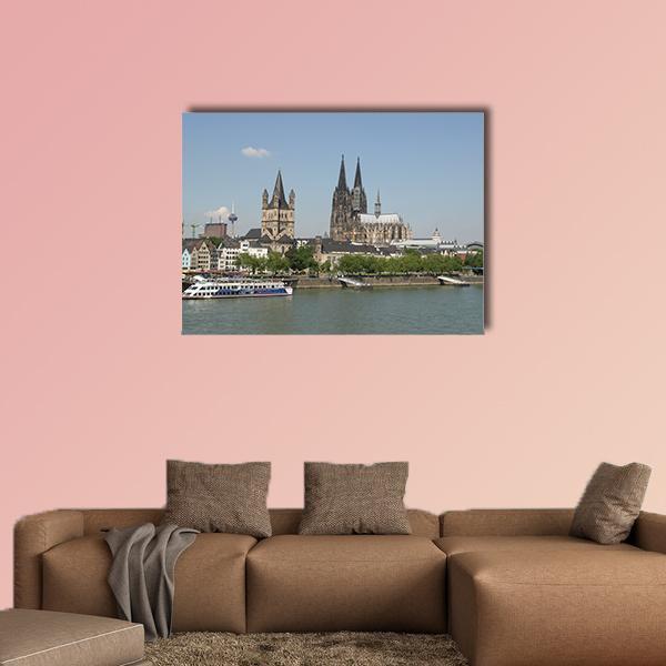 Riverfront City with Gothic Cathedral Canvas Wall Art in gray, green and blue, single panel hung on a wall