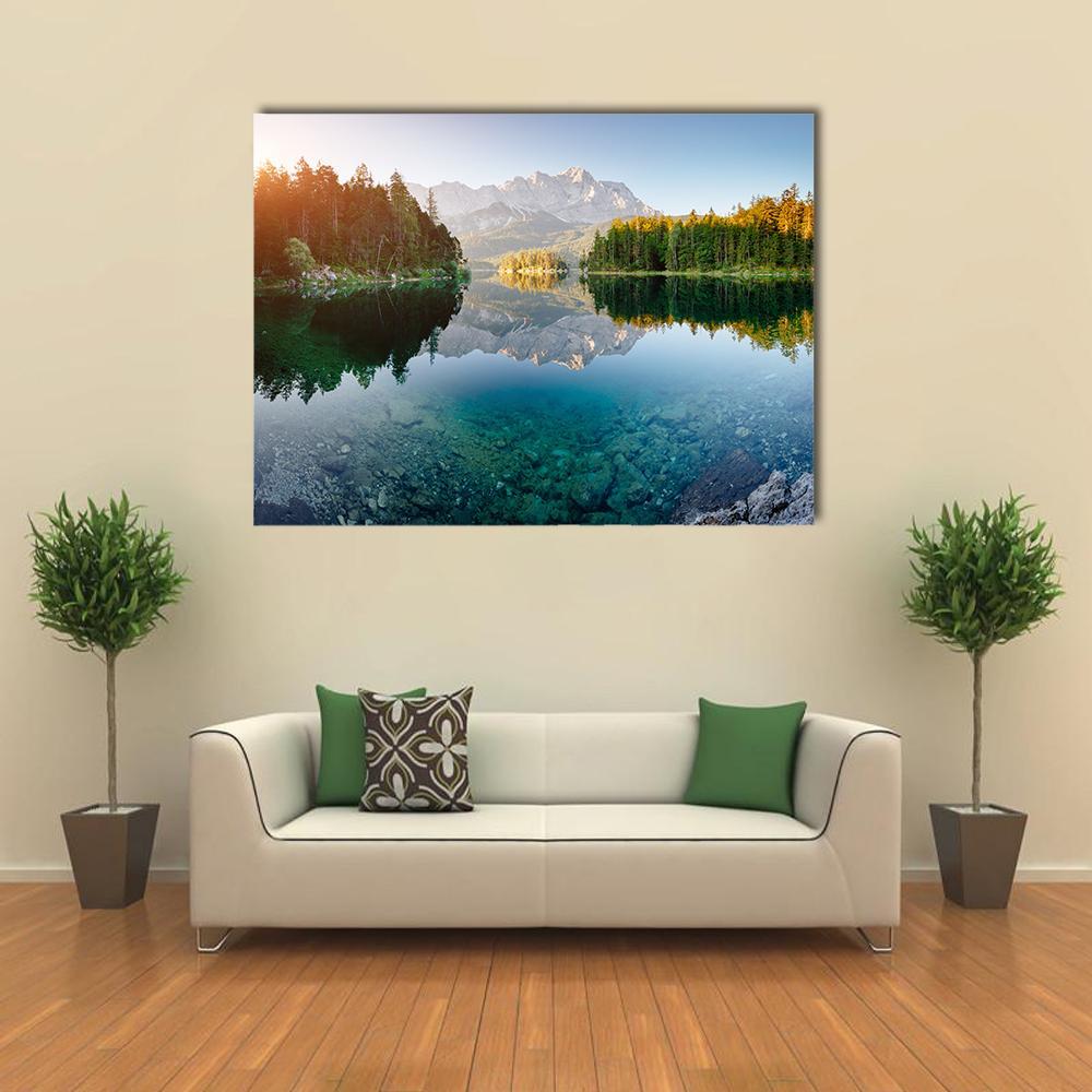Lake Eibsee Morning Reflection Canvas Wall Art in green and blue, single panel hung on a wall