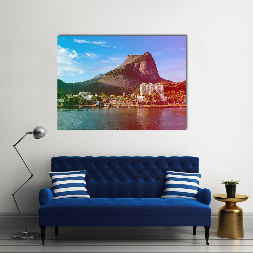 View of Gavea Stone Canvas Wall Art in brown, green and blue, single panel hung on a wall