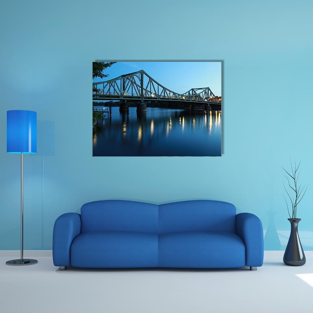 Glienicker Bridge at Night Canvas Wall Art in black, blue and navy, single panel hung on a wall