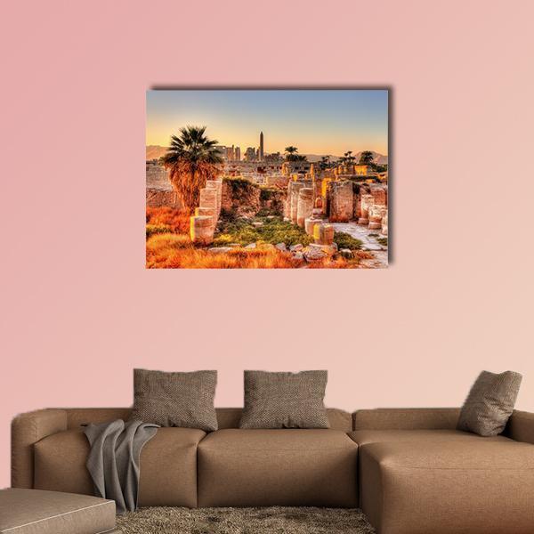 Evening View of Karnak Temple Canvas Wall Art in beige, orange and blue, single panel hung on a wall