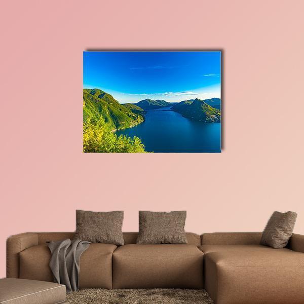 View of Lago Di Lugano Canvas Wall Art in green and blue, single panel hung on a wall