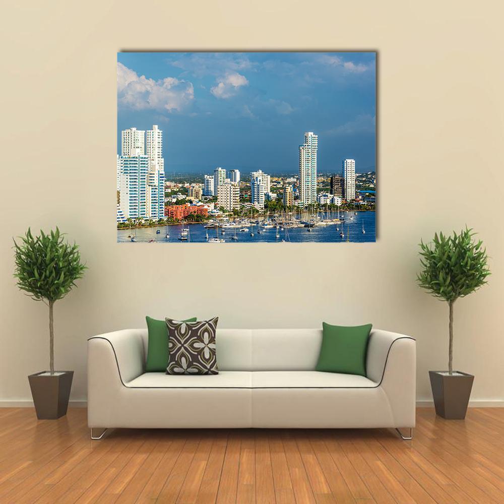 Marina with Tall White Buildings Canvas Wall Art in white and blue, single panel hung on a wall