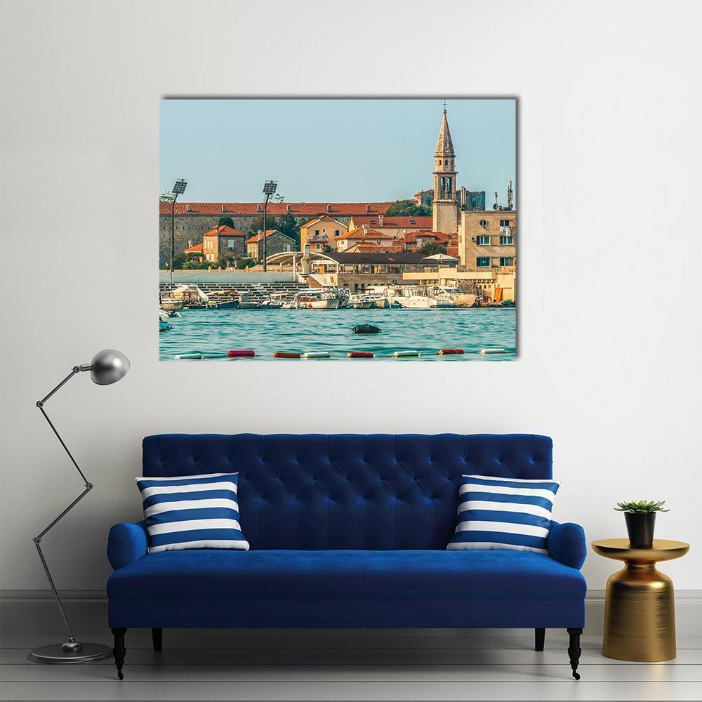 Budva Old Town Harbor View Canvas Wall Art in beige, orange and blue, single panel hung on a wall