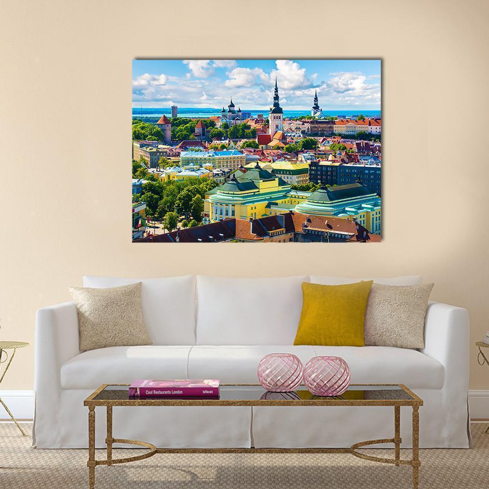 Tallinn Old Town Cityscape Canvas Wall Art in yellow, green and blue, single panel hung on a wall