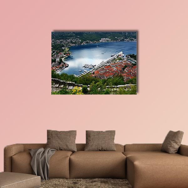 Kotor Old Town Bay with Red Tiled Roofs Canvas Wall Art in red, green and blue, single panel hung on a wall