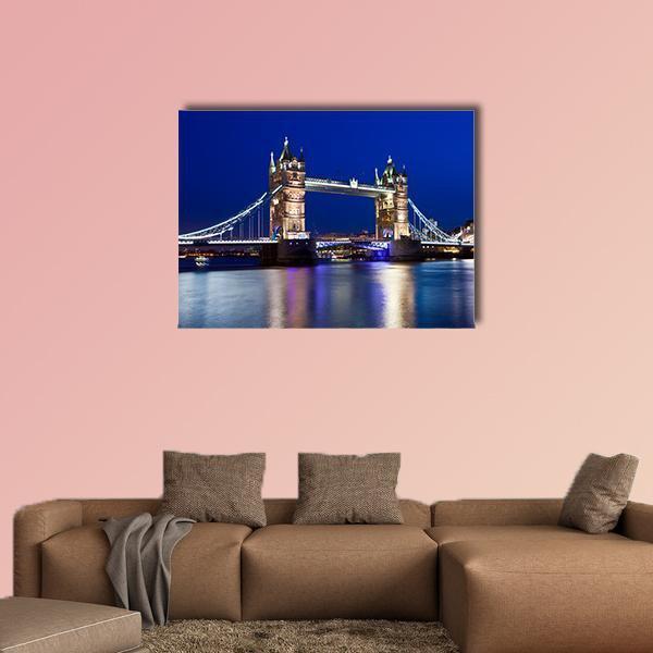 Tower Bridge at Night, London Canvas Wall Art in gold, blue and navy, single panel hung on a wall