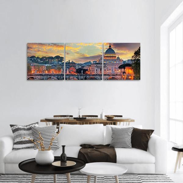 St. Peter's Basilica at Sunset Panoramic Canvas Wall Art in orange, yellow and blue, hung on a wall