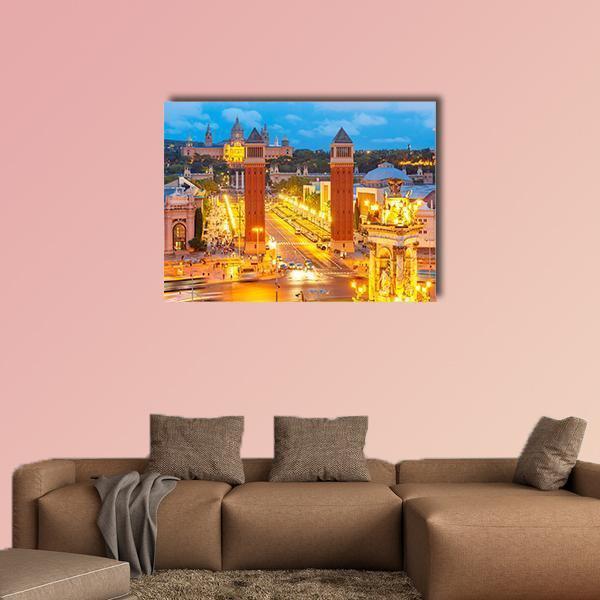 Venetian Towers and Palau Nacional at Night Canvas Wall Art in orange, yellow and blue, single panel hung on a wall