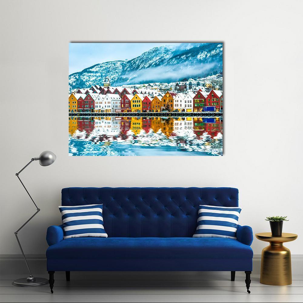 Bergen Colorful Waterfront with Snow-capped Mountains Canvas Wall Art in white, blue and multicolor, single panel hung on a wall