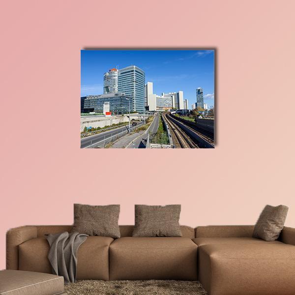 Railway Through Financial District Canvas Wall Art in white, gray and blue, single panel hung on a wall