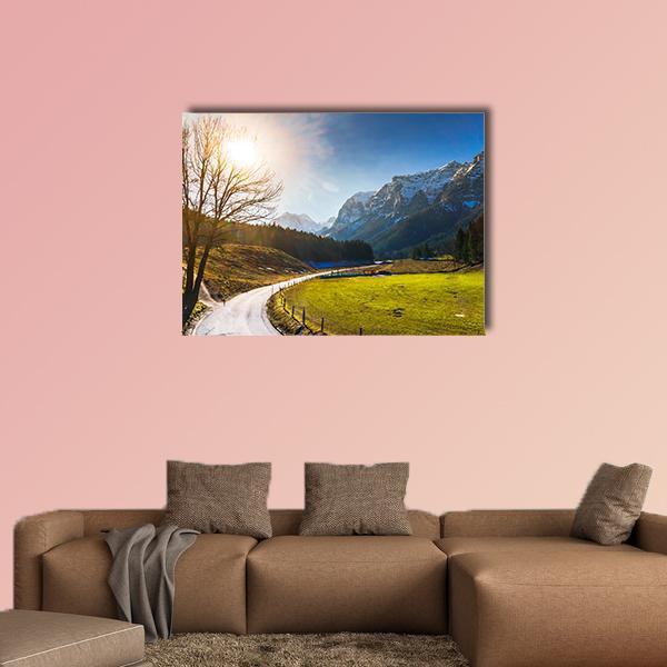 Spring Road to Snow-capped Mountains Canvas Wall Art in yellow, green and blue, single panel hung on a wall