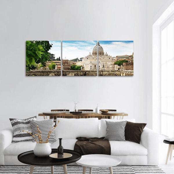 St. Peter's Basilica Over the Tiber Panoramic Canvas Wall Art in white, beige and blue, hung on a wall
