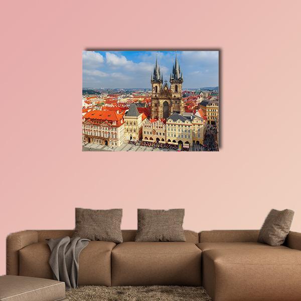 Old Town Square and Týn Church, Prague Canvas Wall Art in beige, orange and blue, single panel hung on a wall