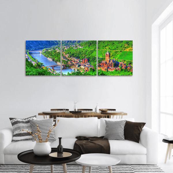 Medieval Castle Over Winding River Valley Panoramic Canvas Wall Art in green and blue, hung on a wall