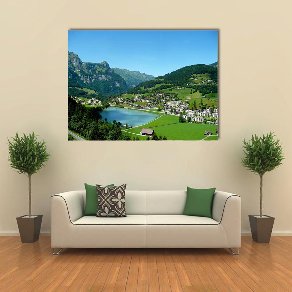 Engelberg Mountain Lake View Canvas Wall Art in green and blue, single panel hung on a wall