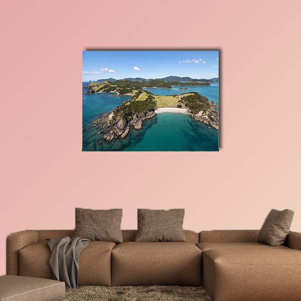 Aerial View of Turquoise Bay and Headlands Canvas Wall Art in green and blue, single panel hung on a wall