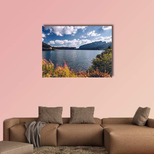 View to Bolboci Lake Canvas Wall Art in white, green and blue, single panel hung on a wall
