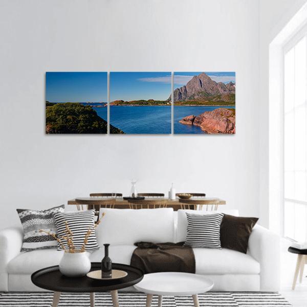 Orsvagvaer Village Coastal Landscape Panoramic Canvas Wall Art in brown, green and blue, hung on a wall