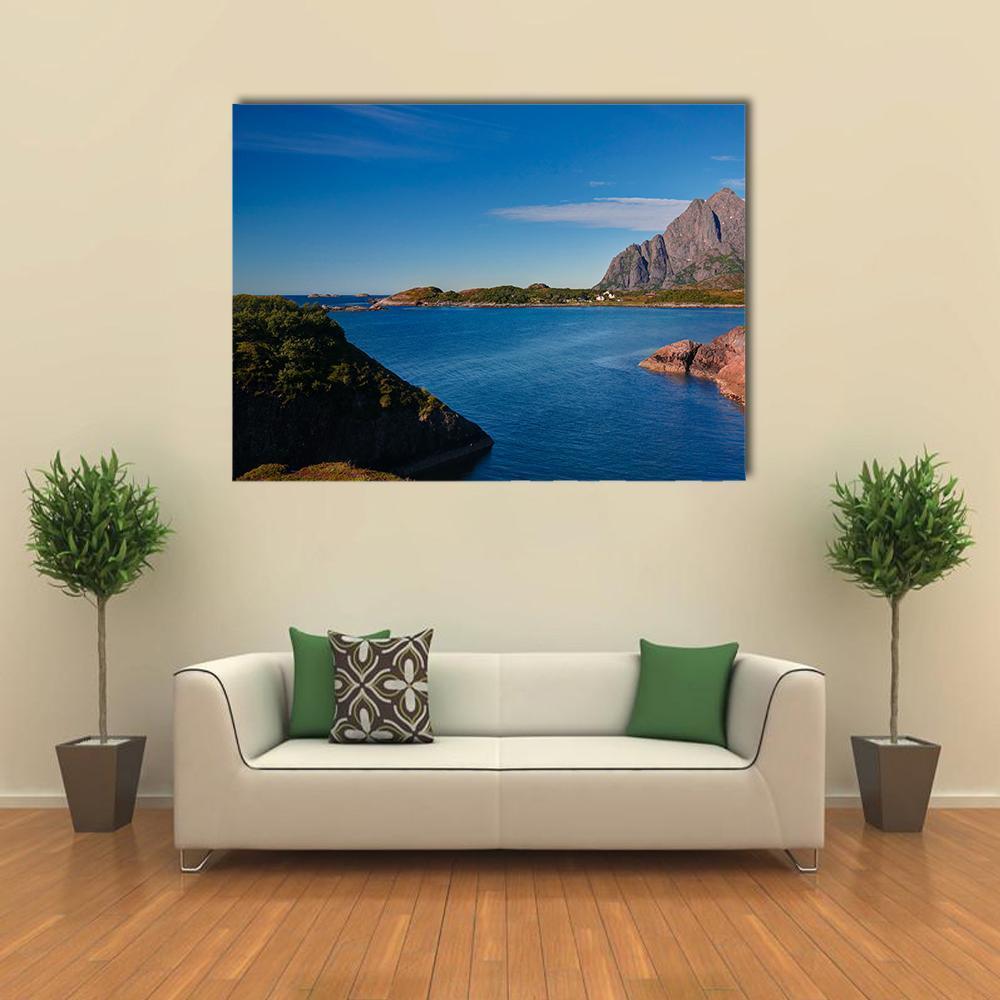 Orsvagvaer Village Coastal Landscape Canvas Wall Art in brown, green and blue, single panel hung on a wall