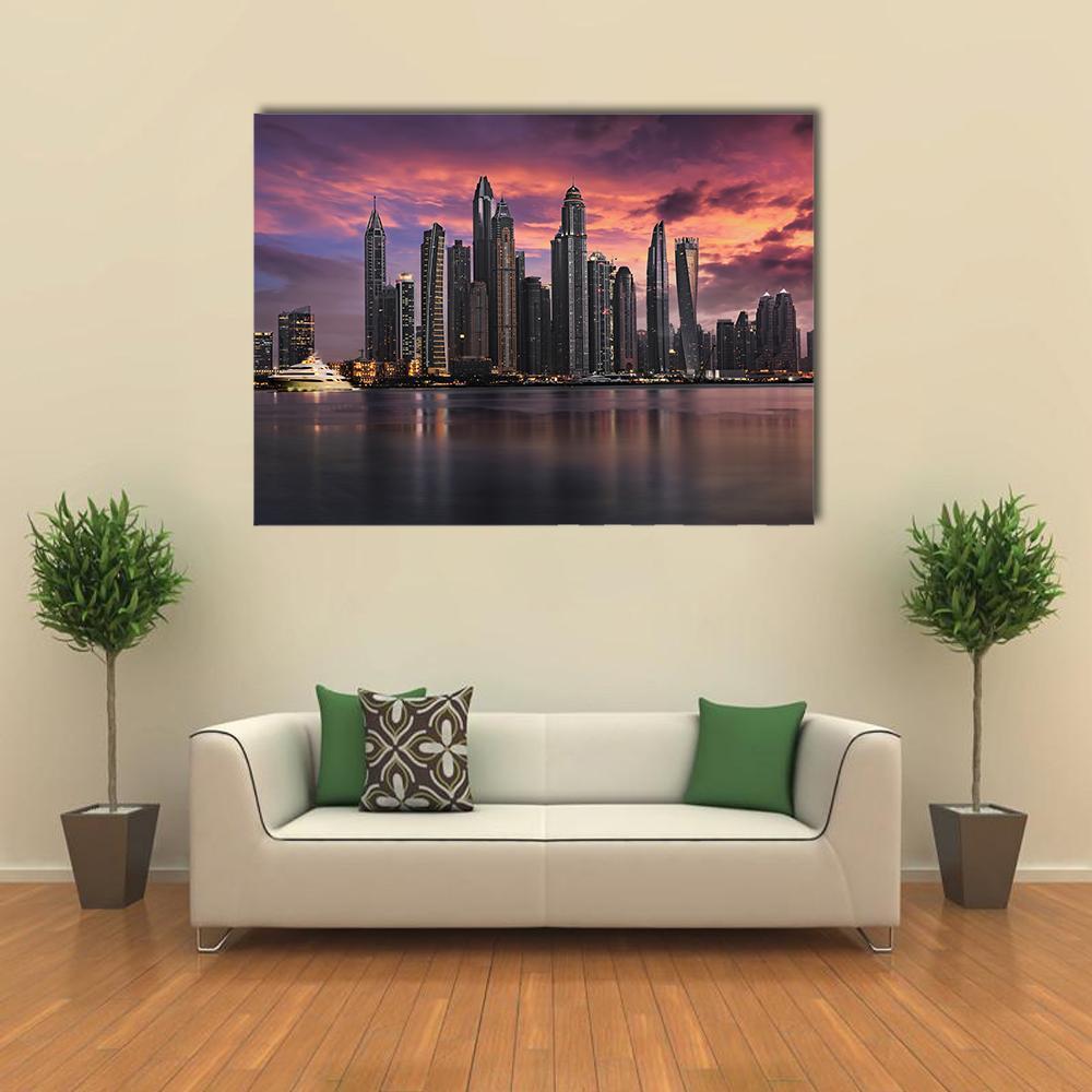 Sunset Over Dubai Marina Skyline Canvas Wall Art in gray, orange and purple, single panel hung on a wall