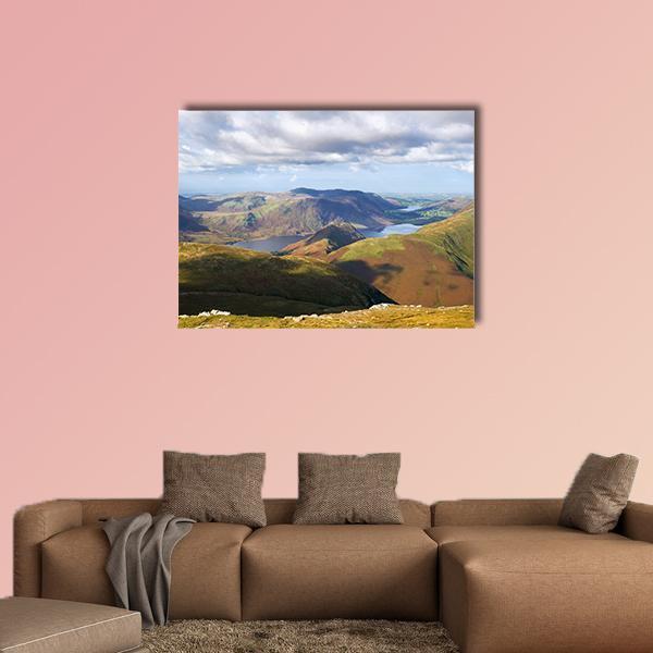 Mountains and Lake with Sunlit Hillsides Canvas Wall Art in brown, green and blue, single panel hung on a wall