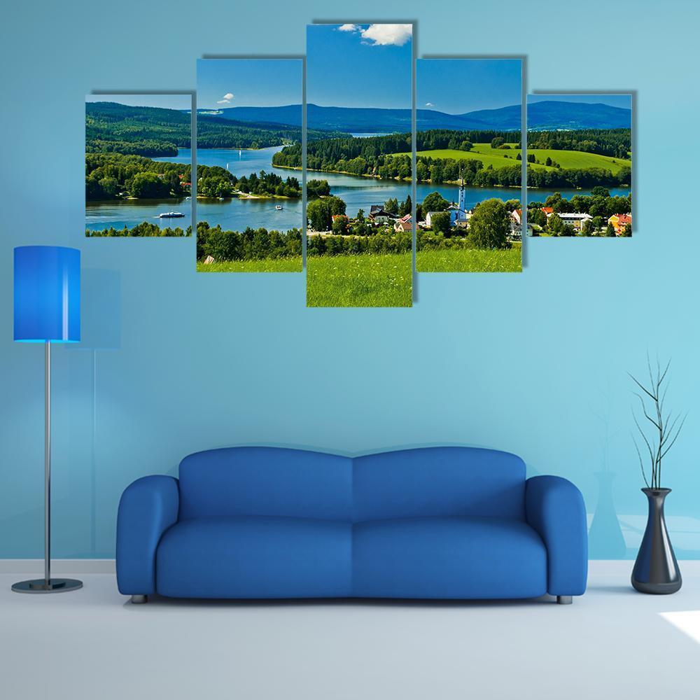 Village by Lipno Lake Canvas Wall Art in white, green and blue, 5 panel Star layout hung on a wall