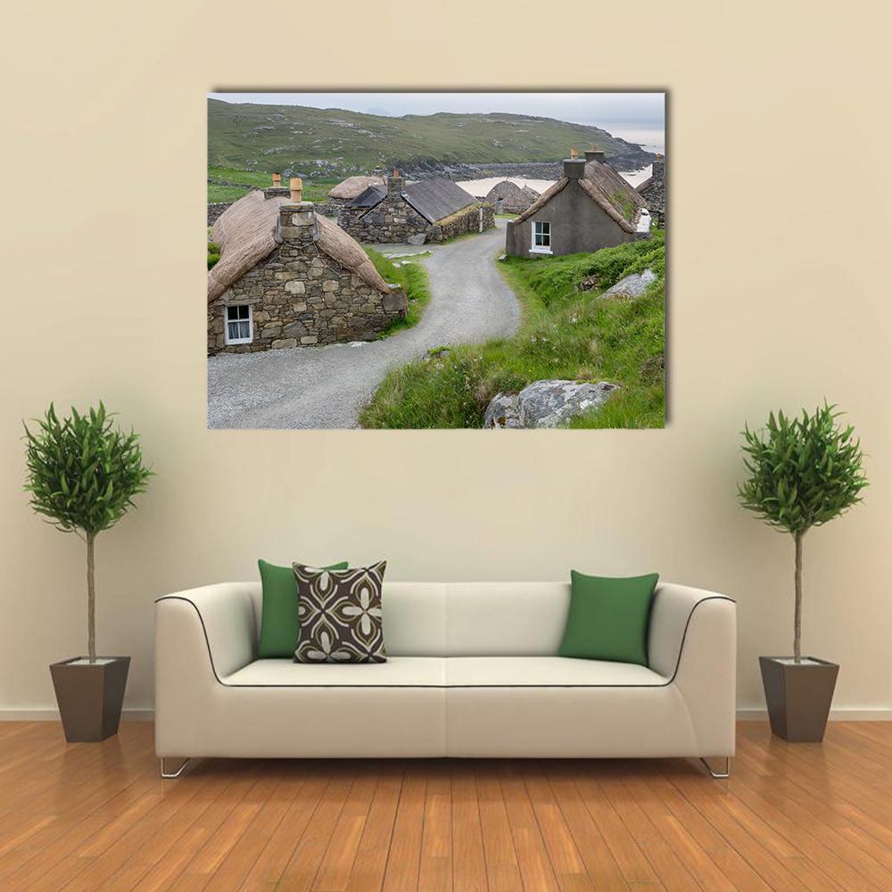 Village of Ancient Blackhouses Canvas Wall Art in gray, brown and green, single panel hung on a wall
