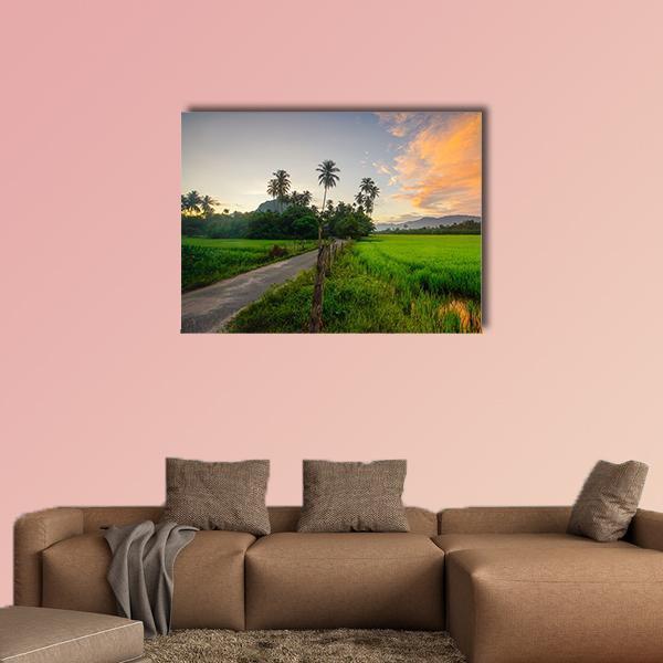 Village Paddy Fields at Sunrise Canvas Wall Art in orange, green and blue, single panel hung on a wall