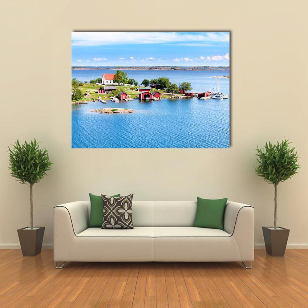 Finnish Archipelago Village with Red Roofs Canvas Wall Art in red, green and blue, single panel hung on a wall