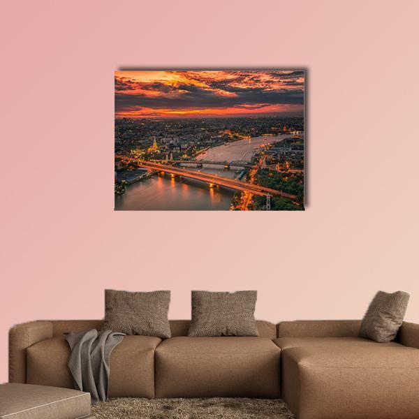 Vintage Bridge at Sunset Canvas Wall Art in black, brown and orange, single panel hung on a wall