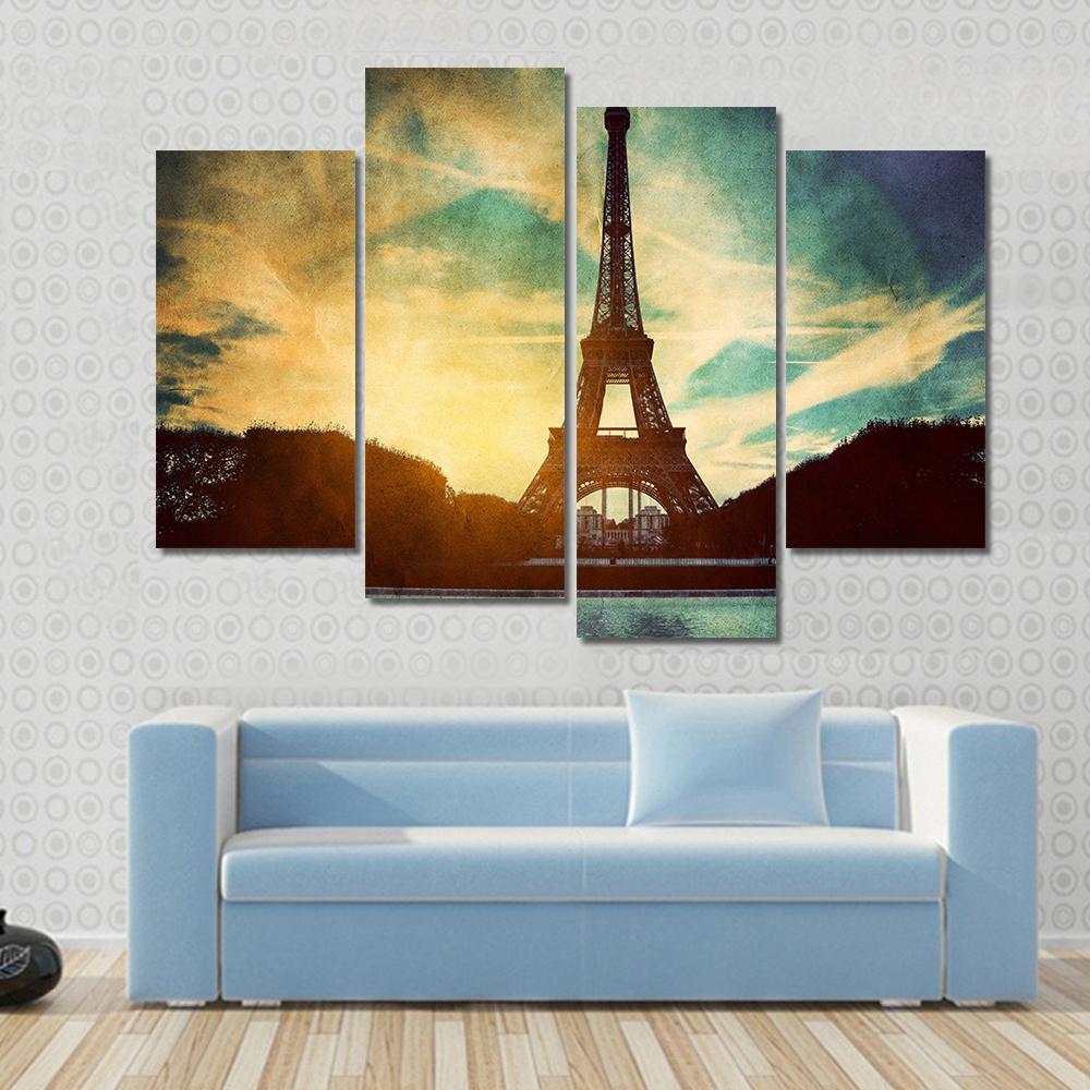 Vintage Retro Eiffel Tower Paris Canvas Wall Art in black, yellow and blue, single panel hung on a wall