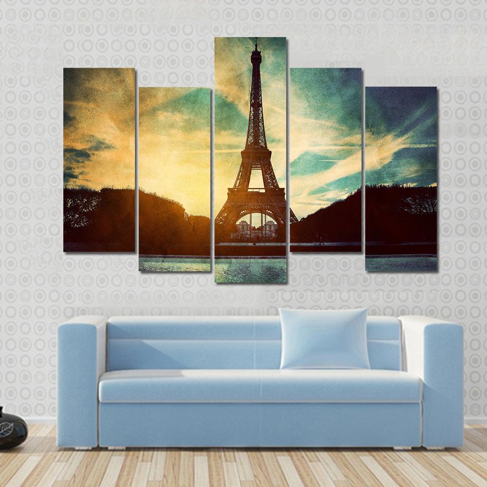 Vintage Retro Eiffel Tower Paris Canvas Wall Art in black, yellow and blue, single panel hung on a wall
