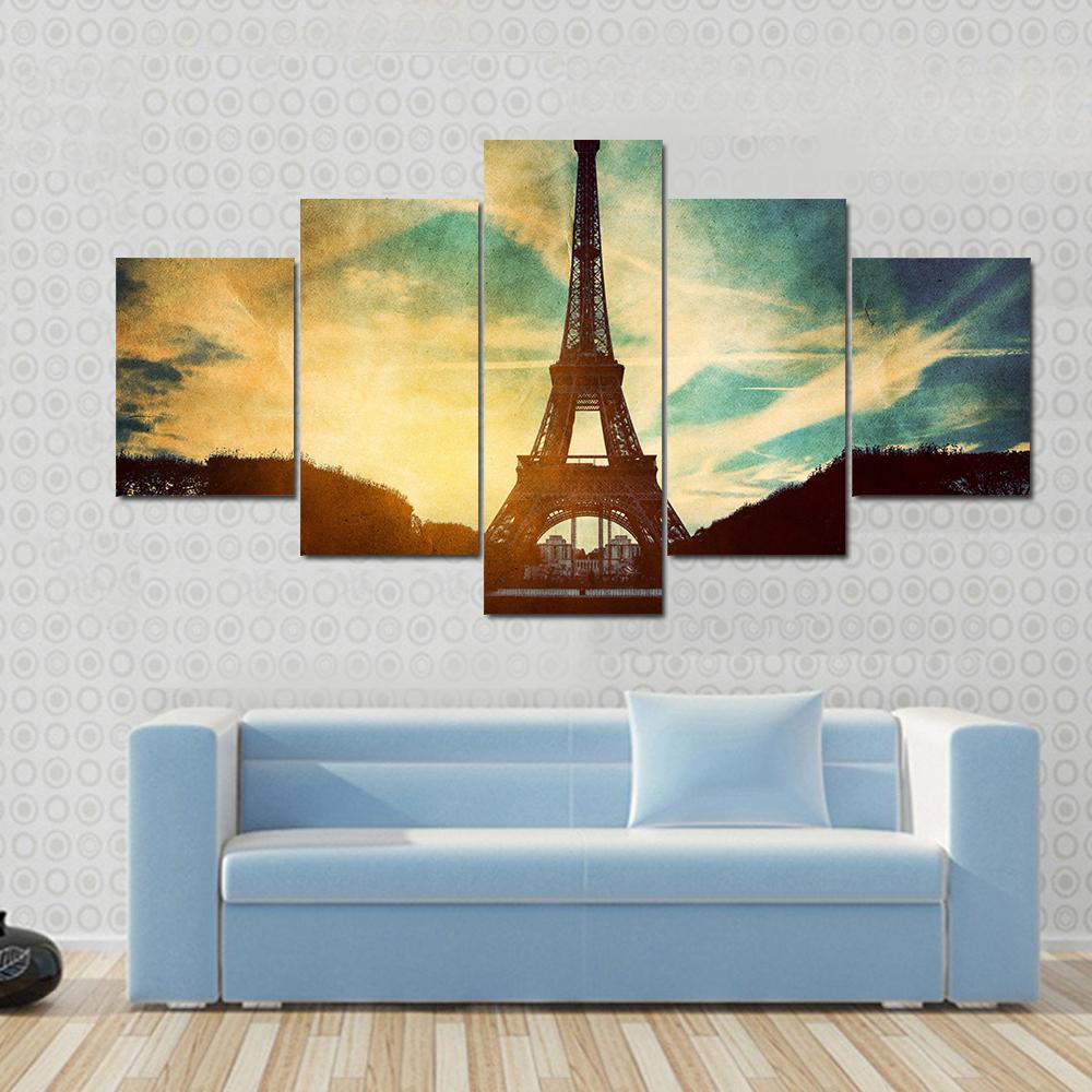 Vintage Retro Eiffel Tower Paris Canvas Wall Art in black, yellow and blue, single panel hung on a wall
